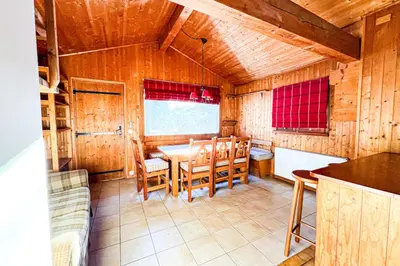 a dining room with a table and chairs at Snowflake cottage with garden in Chamonix-Mont-Blanc