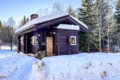 a small cabin in the snow with snow on it at Snowflake cottage with garden in Chamonix-Mont-Blanc