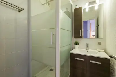a bathroom with a sink and a shower at Les Marmottes En Chaussettes - Happy Rentals in Chamonix-Mont-Blanc