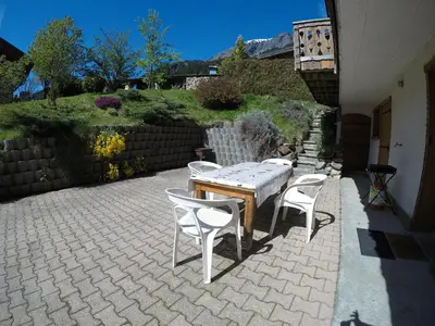 a table and chairs sitting on a patio at Studio 