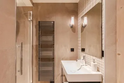a bathroom with a sink and a shower at Rochebrune - Superbe studio au départ des pistes in Megève