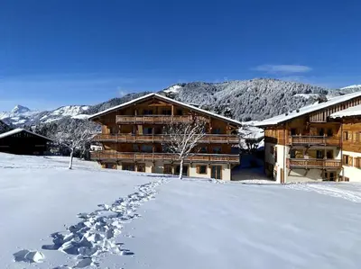 a ski lodge with footprints in the snow at Rochebrune - Superbe studio au départ des pistes in Megève