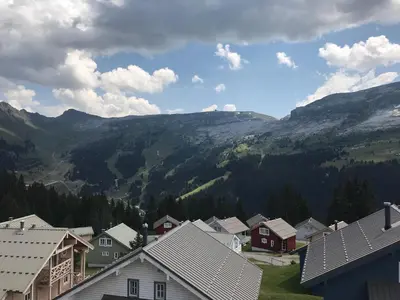 a view of a village with mountains in the background at Appartement confortable 2 chambres, balcon sud, 6 pers. - FR-1-425-213 in Arâches-la-Frasse