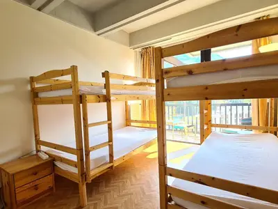 two bunk beds in a room with a window at Appartement lumineux, pied des pistes - 6 pers. - FR-1-425-222 in Arâches-la-Frasse