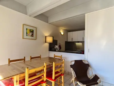 a kitchen and dining room with a table and chairs at Appartement lumineux, pied des pistes - 6 pers. - FR-1-425-222 in Arâches-la-Frasse
