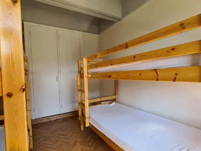a bedroom with two bunk beds and a closet at Appartement lumineux, pied des pistes - 6 pers. - FR-1-425-222 in Arâches-la-Frasse