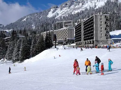 a group of people standing in the snow on a ski slope at Studio lumineux balcon ski aux pieds - 4 pers. - FR-1-425-223 in Arâches-la-Frasse