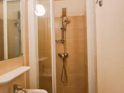 a bathroom with a shower with a toilet and a sink at Appartement spacieux, balcon - 8 pers. - FR-1-425-218 in Arâches-la-Frasse