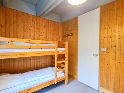 a bunk room with two bunk beds in it at Appartement spacieux, balcon - 8 pers. - FR-1-425-218 in Arâches-la-Frasse