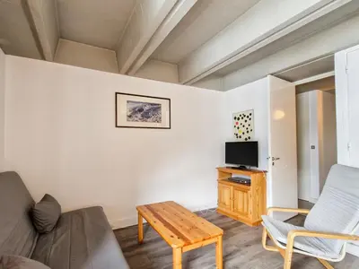 a living room with a couch and a tv at Appartement spacieux balcon sud - 6 pers. - FR-1-425-219 in Arâches-la-Frasse