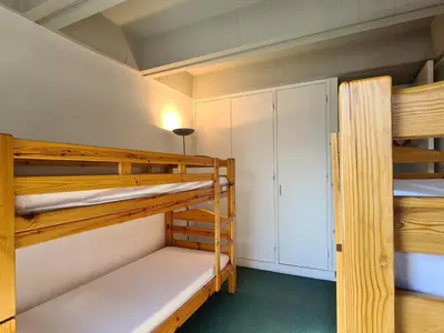 a bunk bed room with two bunk beds at Appartement spacieux balcon sud - 6 pers. - FR-1-425-219 in Arâches-la-Frasse