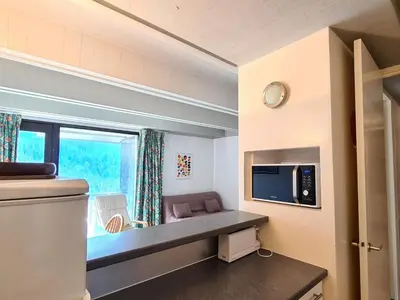 a small room with a couch and a window at Appartement spacieux balcon sud - 6 pers. - FR-1-425-219 in Arâches-la-Frasse