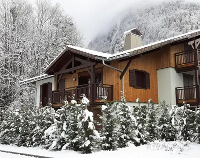 a cabin in the snow with snow covered trees at Samoëns, new apartment, 3 bedrooms, 6 persons, close to village centre and skibus in Samoëns