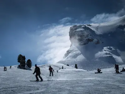 a group of people skiing down a snow covered mountain at Samoëns, new apartment, 3 bedrooms, 6 persons, close to village centre and skibus in Samoëns