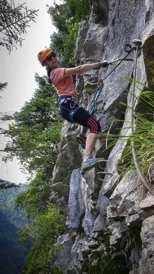 a woman is climbing on a rock wall at Samoëns, new apartment, 3 bedrooms, 6 persons, close to village centre and skibus in Samoëns