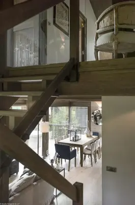 a dining room with a large wooden table and chairs at Chalet Satine - Luxe au pied des pistes in Demi-Quartier