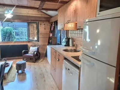 a kitchen with a refrigerator and a sink at Cosy Petite Chalet T3, Jardin, Terrasse, Parking. Chamonix Mont-blanc. in Les Houches
