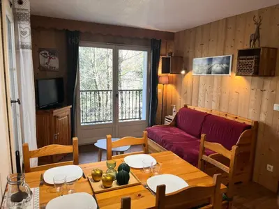 a living room with a table and a couch at Résidence Le Grand Panorama - Grand Panorama 214 MAE-7851 in Saint-Gervais-les-Bains