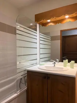 a bathroom with a sink and a tub and a mirror at Résidence Le Grand Panorama - Grand Panorama 214 MAE-7851 in Saint-Gervais-les-Bains