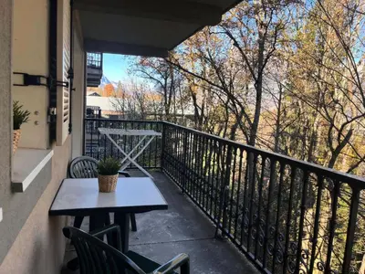 a patio with a table and chairs on a balcony at Résidence Le Grand Panorama - Grand Panorama 214 MAE-7851 in Saint-Gervais-les-Bains