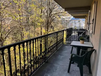 a balcony with a table and chair on a balcony at Résidence Le Grand Panorama - Grand Panorama 214 MAE-7851 in Saint-Gervais-les-Bains