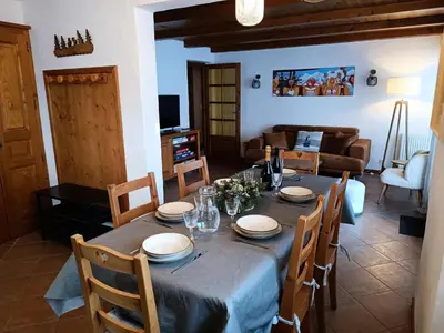 a dining room with a table and a living room at Résidence La Planchette - L'Alpin - 4 pièces dans un chalet individuel MAE-7861 in Saint-Gervais-les-Bains
