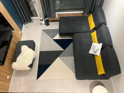 an overhead view of a living room with a black couch at Flaine Forum G1 Cassiopée Mezzanine & Terrasse in Flaine