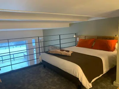 a bedroom with a large bed and a large window at Flaine Forum G1 Cassiopée Mezzanine & Terrasse in Flaine