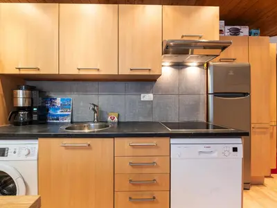 a kitchen with a sink and a dishwasher at Praz des Esserts - 43 - Appt pied pistes - 6 pers in Morillon