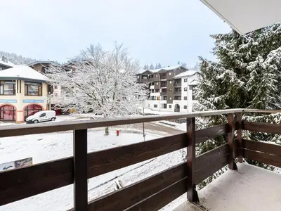 a view from the balcony of a house covered in snow at Praz des Esserts - 43 - Appt pied pistes - 6 pers in Morillon