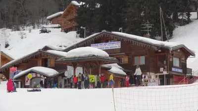 a person is skiing down a snow covered mountain at Le Grand Panorama No11 in Saint-Gervais-les-Bains