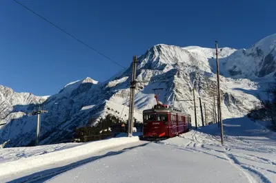 a red train on a ski lift in the snow at Le Grand Panorama No11 in Saint-Gervais-les-Bains