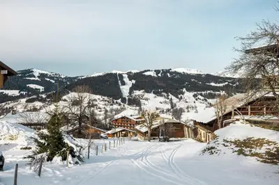 a village covered in snow with mountains in the background at Appartement Solaris - Magnificent views and great exposure! in Megève