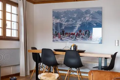 a dining room with a table and chairs at Appartement Solaris - Magnificent views and great exposure! in Megève