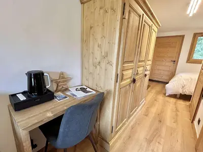 a room with a wooden desk with a coffee maker on it at Charmant studio avec balcon exposé sud, casier à skis et parking, proche des pistes à Demi-Quartier - FR-1-597-175 in Demi-Quartier