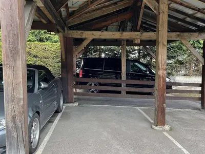 a car parked in a parking lot with a barn at Charmant studio avec balcon exposé sud, casier à skis et parking, proche des pistes à Demi-Quartier - FR-1-597-175 in Demi-Quartier