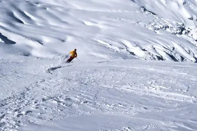 a person is skiing down a snow covered mountain at Luxury Studio - Mountain View & 100m to Slopes - Near Chamonix in Les Houches
