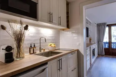 a kitchen with a sink and a counter top at Luxury Studio - Mountain View & 100m to Slopes - Near Chamonix in Les Houches