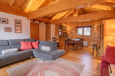 a living room with a couch and a table at Apartment Capucin - A 3 Bedroom Chamonix Mountain Loft in Chamonix-Mont-Blanc