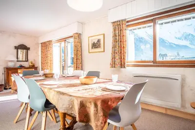 a dining room with a table and chairs at Le Savoy 2 - Pied des pistes - Centre in Chamonix-Mont-Blanc