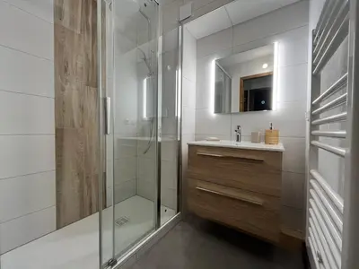 a bathroom with a shower and a sink at Appartement rénové avec piscine à Samoëns - FR-1-624-151 in Samoëns