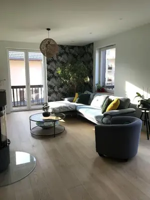 a living room with a couch and a table at Maison Sallanches 12 couchages in Sallanches