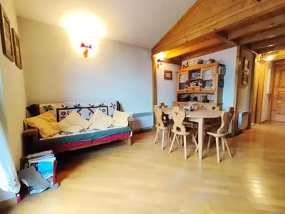 a living room with a couch and a table at Résidence Aigle Royal - L'Aigle Royal MAE-7671 in Les Houches