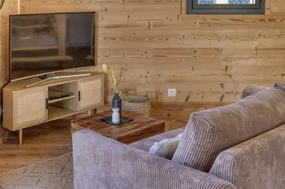 a living room with two couches and a tv at chalet Louis situé 25 km Chamonix in Saint-Gervais-les-Bains