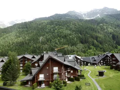 a lodge in the mountains with mountains in the background at Résidence Combettes - Combettes D300 MAE-4071 in Les Contamines-Montjoie