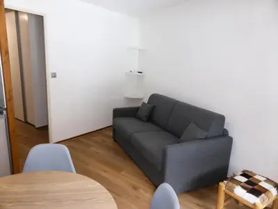 a living room with a couch and a table at Résidence Combettes - Combettes D300 MAE-4071 in Les Contamines-Montjoie