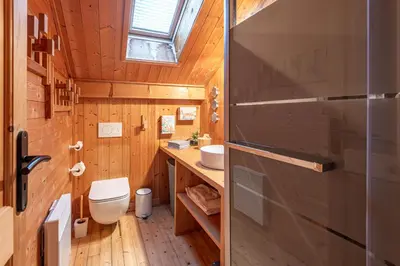 a small bathroom with a toilet and a sink at SmartStay - Chalet face au mont Blanc in Sallanches