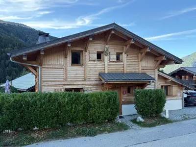a log cabin with a gambrel roof at Individual chalet for up to 12 people maximum in Les Contamines-Montjoie