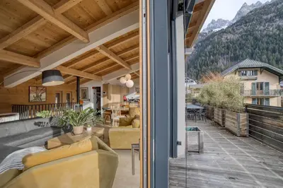 a living room with a view of a house at Chalet 124 in Chamonix-Mont-Blanc