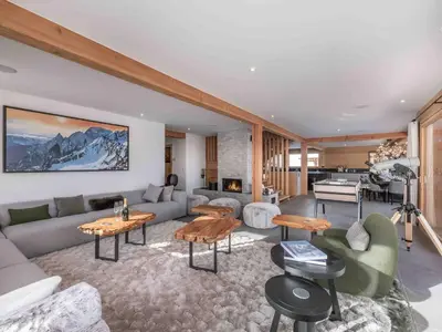 a living room with a couch and a piano at Chalet moderne à Combloux avec piscine et espace bien-être - FR-1-569-160 in Combloux